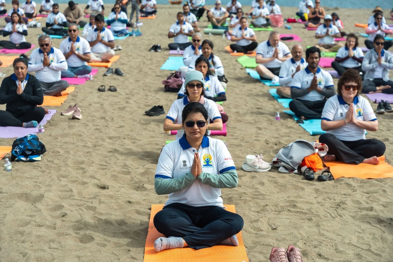 Where the Pacific meets the pose — Yoga at the Golden Gate.  On June 20, 2026, @CGISFO marked the 12th #InternationalDayofYoga2026 at Crissy Field East Beach, San Francisco, against the magnificent backdrop of the iconic Golden Gate Bridge emerging through the morning fog.