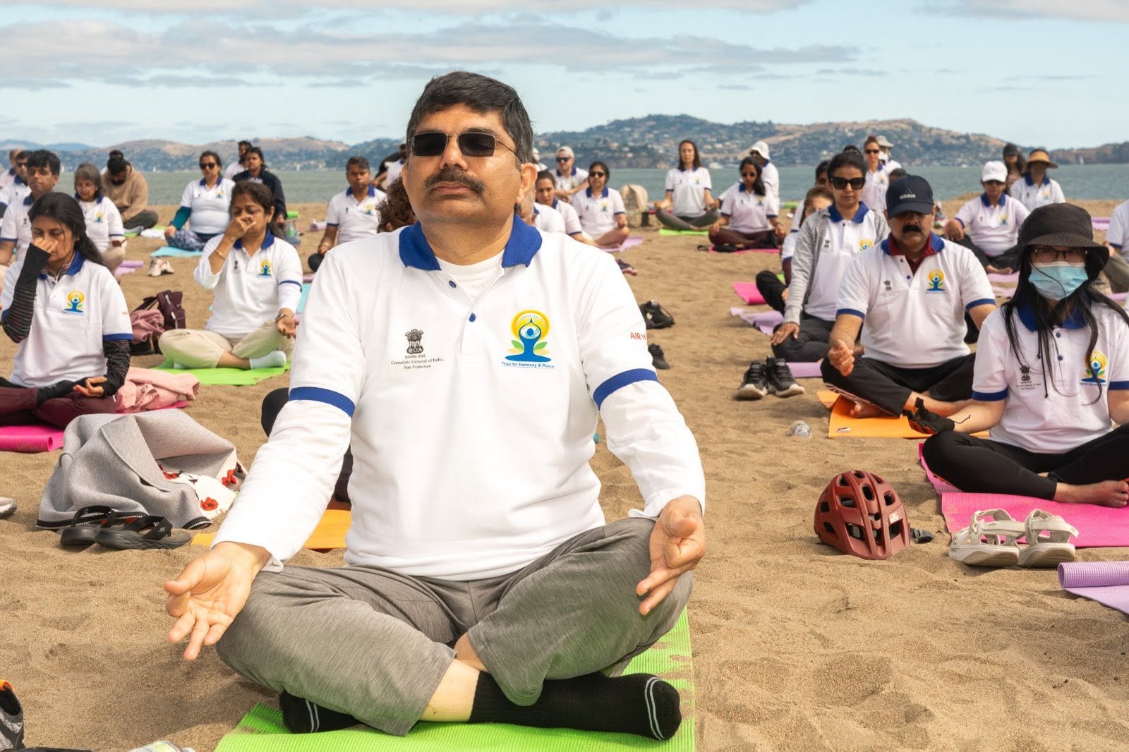 Where the Pacific meets the pose — Yoga at the Golden Gate.  On June 20, 2026, @CGISFO marked the 12th #InternationalDayofYoga2026 at Crissy Field East Beach, San Francisco, against the magnificent backdrop of the iconic Golden Gate Bridge emerging through the morning fog.
