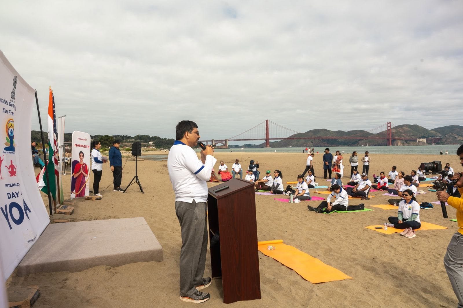 Where the Pacific meets the pose — Yoga at the Golden Gate.  On June 20, 2026, @CGISFO marked the 12th #InternationalDayofYoga2026 at Crissy Field East Beach, San Francisco, against the magnificent backdrop of the iconic Golden Gate Bridge emerging through the morning fog.
