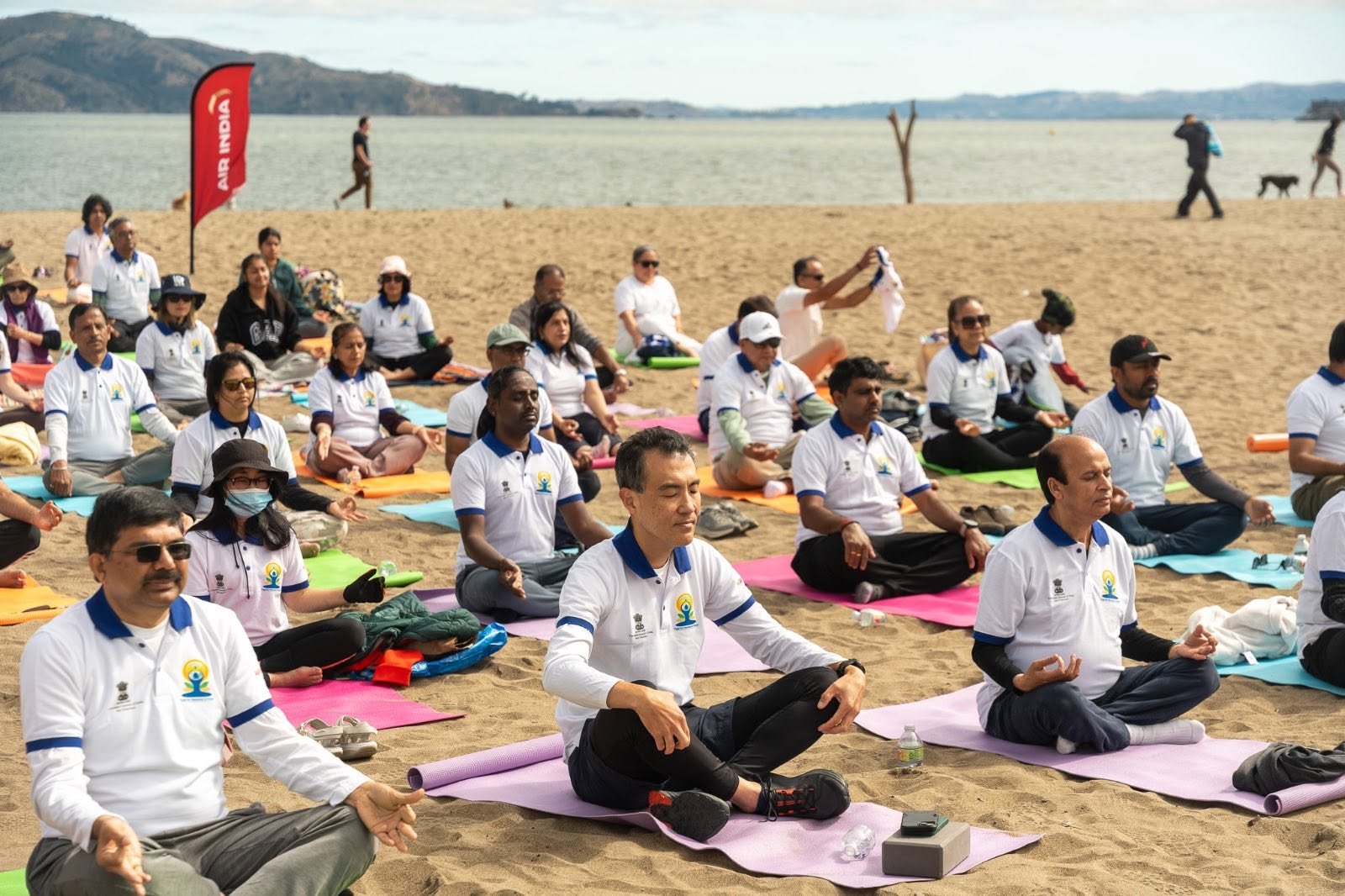Where the Pacific meets the pose — Yoga at the Golden Gate.  On June 20, 2026, @CGISFO marked the 12th #InternationalDayofYoga2026 at Crissy Field East Beach, San Francisco, against the magnificent backdrop of the iconic Golden Gate Bridge emerging through the morning fog.