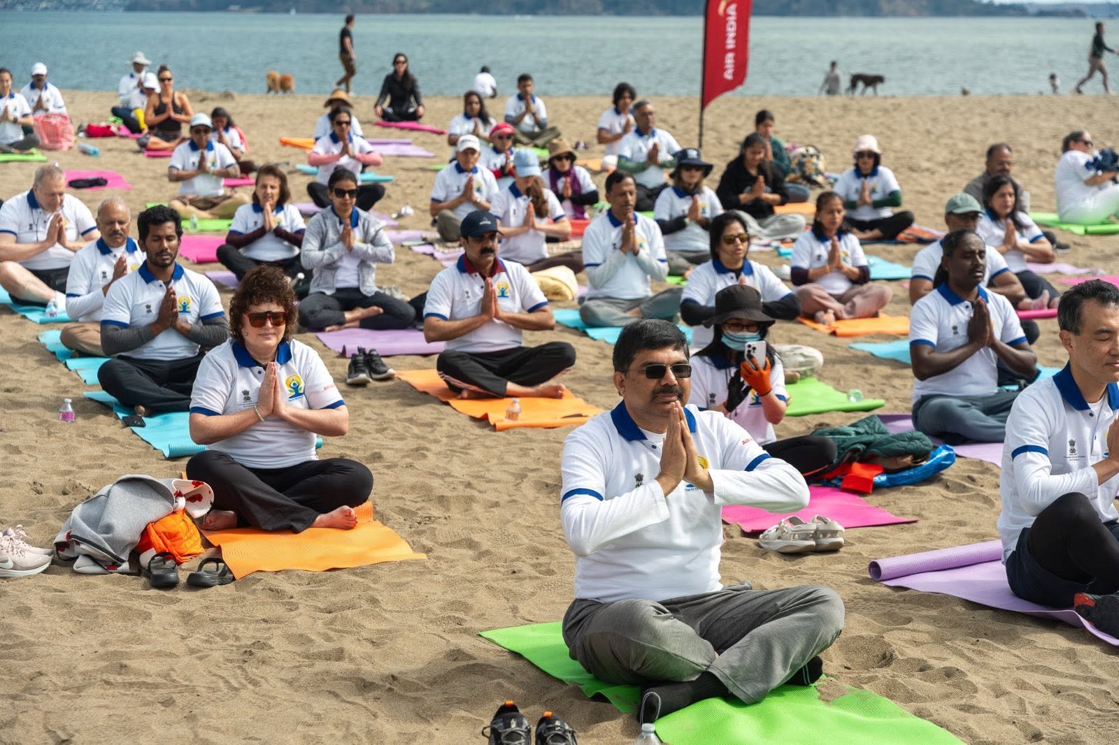 Where the Pacific meets the pose — Yoga at the Golden Gate.  On June 20, 2026, @CGISFO marked the 12th #InternationalDayofYoga2026 at Crissy Field East Beach, San Francisco, against the magnificent backdrop of the iconic Golden Gate Bridge emerging through the morning fog.
